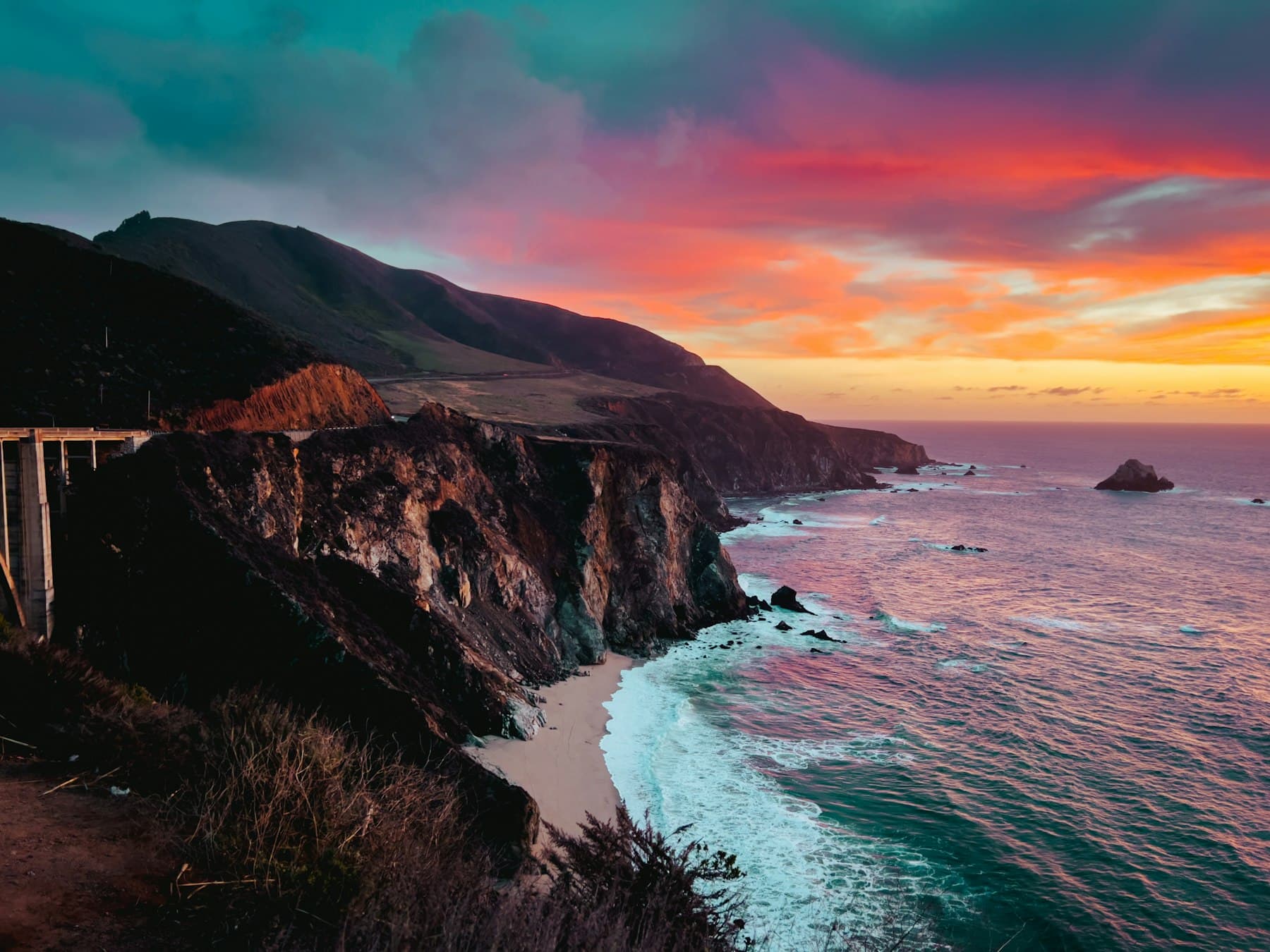 Bixby Creek Bridge and the Big Sur coastline at sunset, California